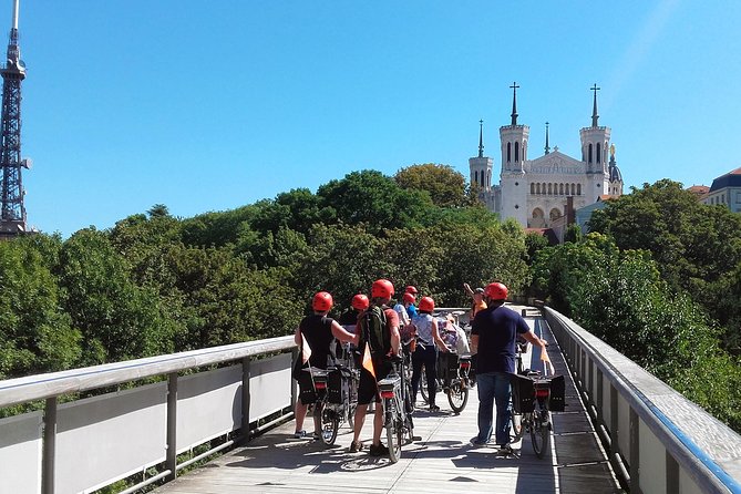 4h Complete Lyon Experience: E-Bike, Food Tasting & Old Town Walk - Lyon’s murals and squares add local character