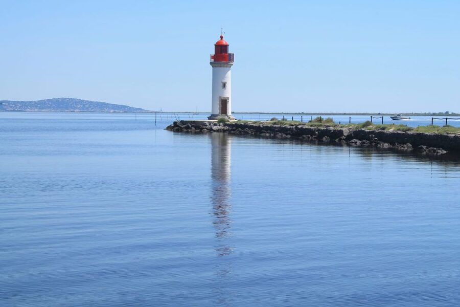 Boat trip in the canals is on the Thau pond - Passing beneath the view of Mont Saint-Clair
