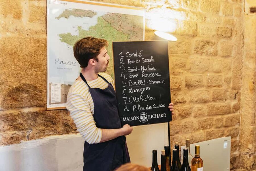 Cheese & Wine Tasting in Montmartre with Local Cheesemonger - Eight cheeses, five wines, and a lot to eat