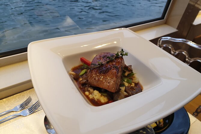 Dinner Cruise Prestige Check-out from the Eiffel Tower - Reading the three-course menu