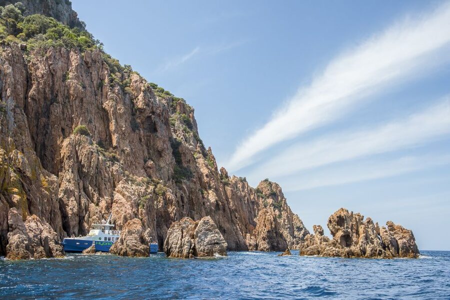 From Ota: Scandola Nature Reserve Eco-Friendly Boat Tour - Boat comfort, seating, and weather concerns