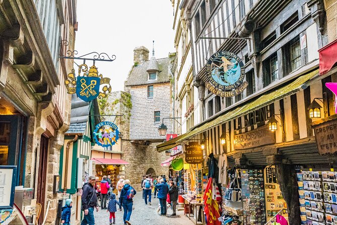 Mont Saint Michel Day Trip from Paris with English Speaking Guide - Entering Mont Saint Michel Abbey with the audio app