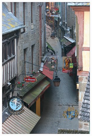 Mont Saint Michel Guided Day Trip with Abbey Entry from Paris - Walking the fortifications and climbing toward the Abbey