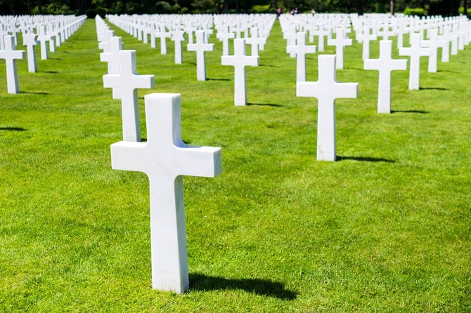 Normandy D-Day Small-Group Day Trip with Omaha Beach, Cemetery & Cider Tasting - German guns at Longues-sur-Mer show the other side