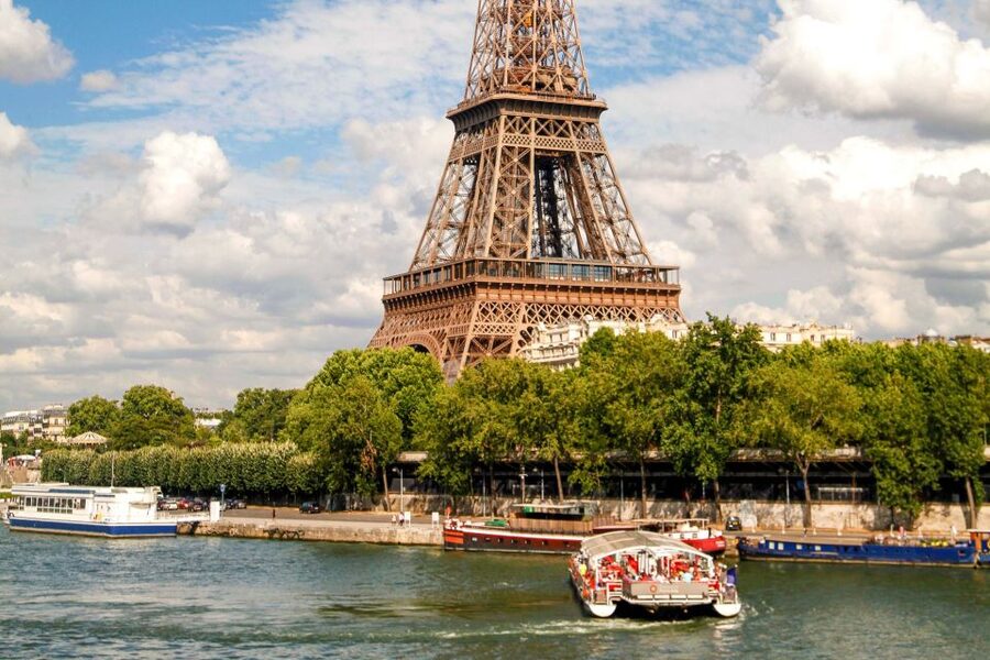 Paris: Eiffel Tower Access by Elevator & Seine River Cruise - Entering the Eiffel Tower by reserved elevator