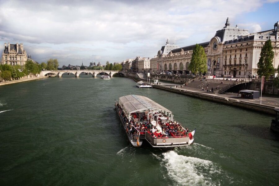 Paris: Eiffel Tower Hosted Tour, Seine Cruise and City Tour - A one-hour Seine cruise with Paris at river level