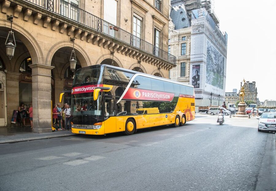 Paris: Openair Double Decker Bus Audio-Guided City Tour - What the enclosed double-decker bus feels like